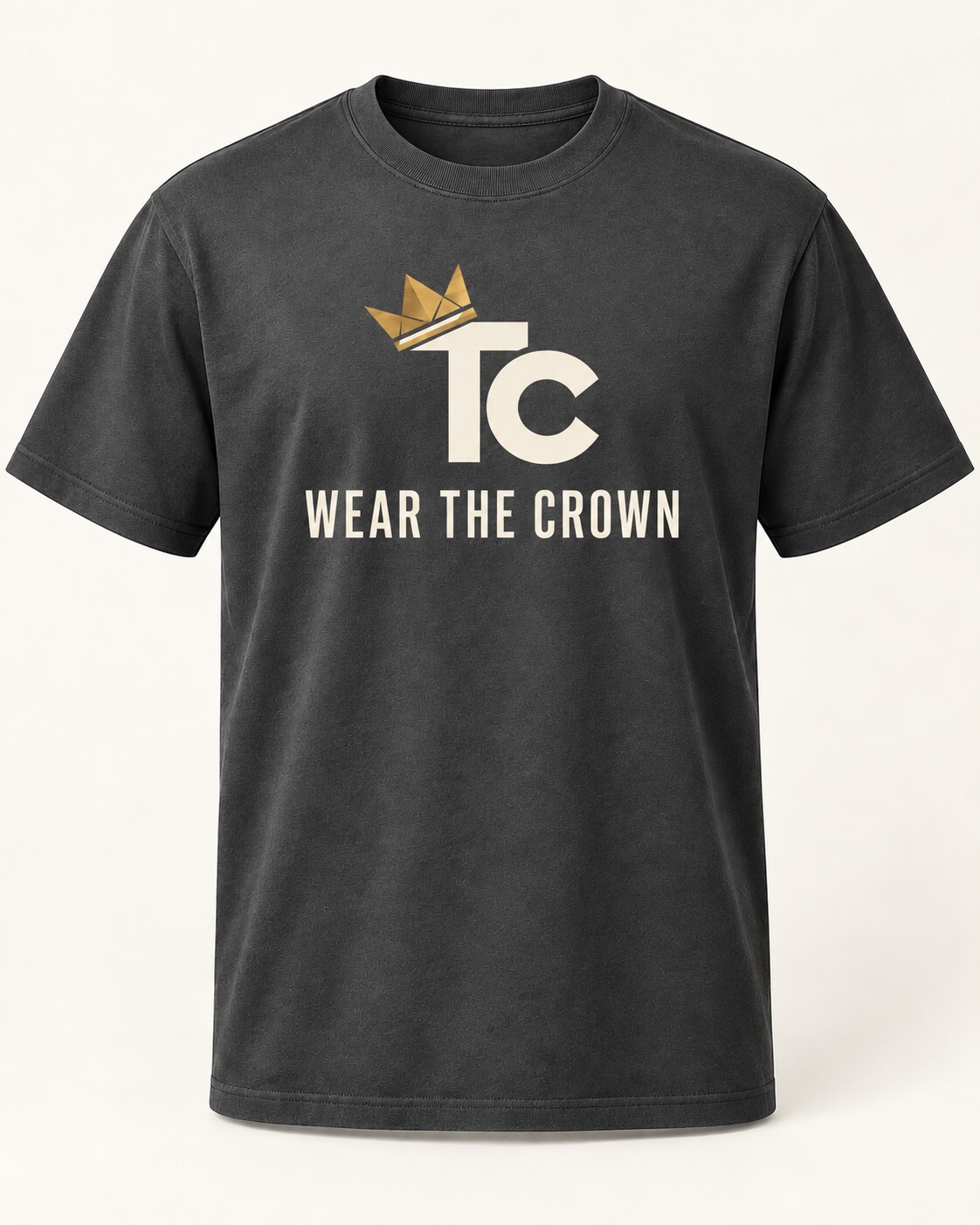 The Standard Tee with a cream crowned TC monogram above the words Wear the Crown on a charcoal shirt.